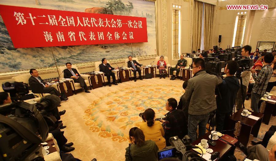 Deputies to the 12th National People's Congress (NPC) from south China's Hainan Province take part in a discussion in Beijing, capital of China, March 6, 2013. The discussion which was held by the Hainan delegation to the first session of the 12th NPC was open to media on Wednesday. (Xinhua/Jin Liwang)