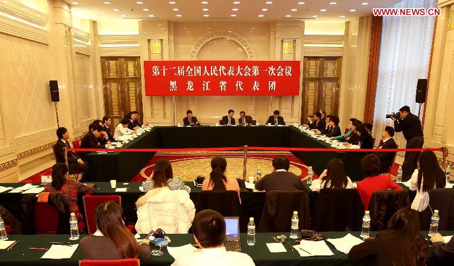 Deputies to the 12th National People's Congress (NPC) from northeast China's Heilongjiang Province take part in a discussion in Beijing, capital of China, March 6, 2013. The discussion which was held by the Heilongjiang delegation to the first session of the 12th NPC was open to media on Wednesday. (Xinhua/Jin Liwang)