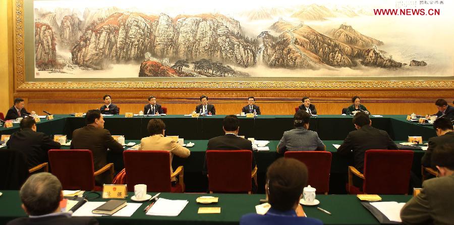 Deputies to the 12th National People's Congress (NPC) from Beijing take part in a discussion in Beijing, capital of China, March 6, 2013. The discussion which was held by the Beijing delegation to the first session of the 12th NPC was open to media on Wednesday. (Xinhua/Wang Shen)