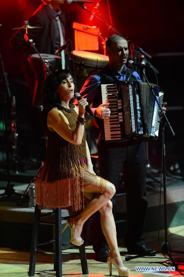 Musical artist Rita performs during her concert that is entitled as Tunes for Peace and sponsored by the Mission of Israel to the United Nations, at the General Assembly Hall of the United Nations headquarters, in New York, on March 5, 2013. Rita, an artist of Israel-Iranian heritage, sang in both Hebrew and Persian during the concert here on Tuesday. (Xinhua/Niu Xiaolei)