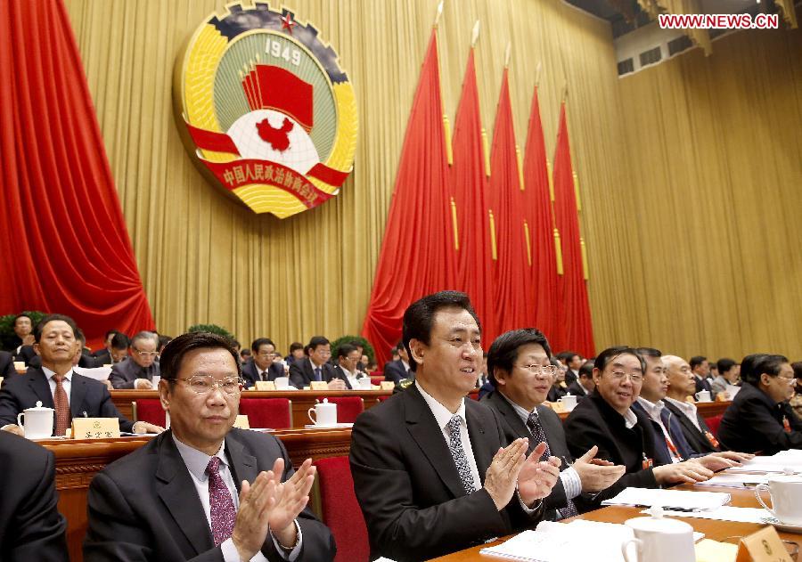 Members of the 12th National Committee of the Chinese People's Political Consultative Conference (CPPCC) listen at the second plenary meeting of the first session of the 12th CPPCC National Committee at the Great Hall of the People in Beijing, capital of China, March 7, 2013. (Xinhua/Ju Peng)  