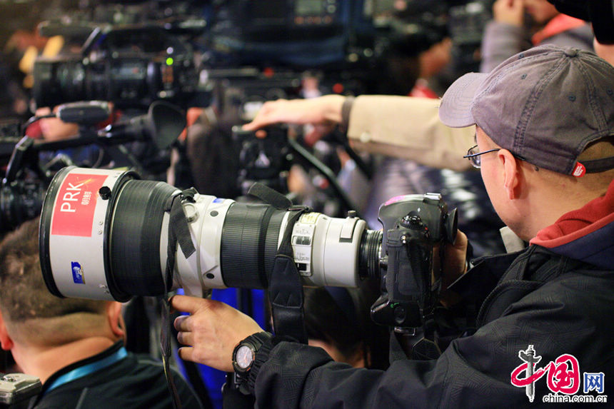 A reporter from the People's Democratic Republic of Korea (DPRK) covers the press conference of the First Session of the 12th National People's Congress on March 4, 2013. Over 3,000 reporters have registered for the coverage of the First Session of the Chinese People's Political Consultative Conference (CPPCC) and the First Session of the 12th National People's Congress (NPC), taking place from March 3 to 17. More than 800 of the reporters have flown in from overseas, according to Xinhua statistics.