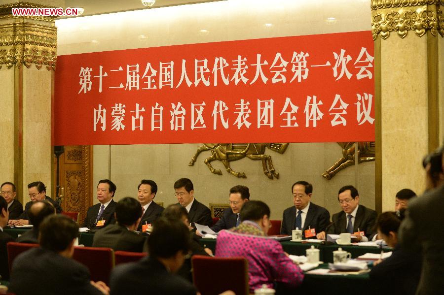 Deputies to the 12th National People's Congress (NPC) from north China's Inner Mongolia Autonomous Region take part in a discussion in Beijing, capital of China, March 7, 2013. The discussion which was held by the Inner Mongolia delegation to the first session of the 12th NPC was open to media on Thursday. (Xinhua/Wang Jianhua)