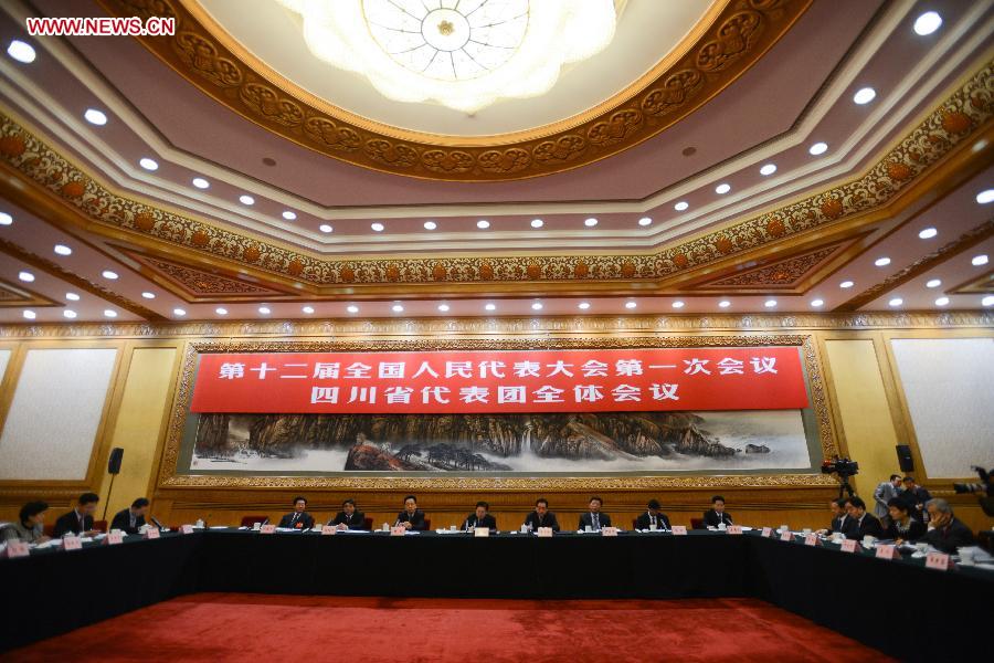 Deputies to the 12th National People's Congress (NPC) from southwest China's Sichuan Province take part in a discussion in Beijing, capital of China, March 7, 2013. The discussion which was held by the Sichuan delegation to the first session of the 12th NPC was open to media on Thursday. (Xinhua/Wang Jianhua)