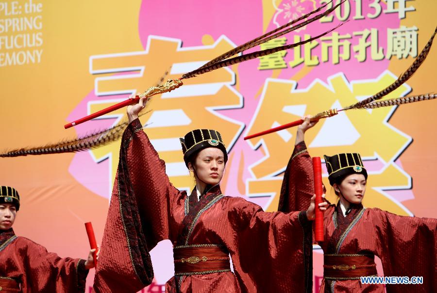 Performers give a show during a press conference of the spring sacrificing ceremony of the Confucius Temple in Taipei, southeast China's Taiwan, March 7, 2013. The ancient-style ceremony, which is held annually to encourage students to set clear goals and study hard in the beginning of a year, will be held on March 10 this year. (Xinhua/Xie Xiudong) 