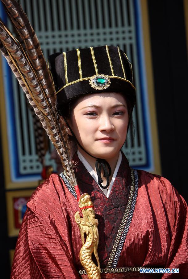 A performer waits for a show during a press conference of the spring sacrificing ceremony of the Confucius Temple in Taipei, southeast China's Taiwan, March 7, 2013. The ancient-style ceremony, which is held annually to encourage students to set clear goals and study hard in the beginning of a year, will be held on March 10 this year. (Xinhua/Xie Xiudong) 