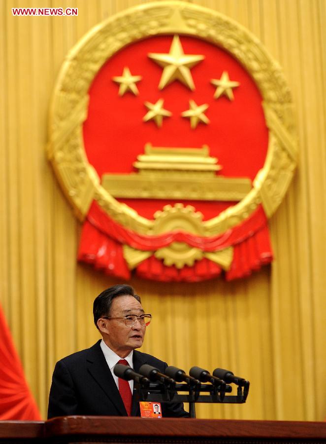 Wu Bangguo delivers a work report of the Standing Committee of the National People's Congress (NPC) during the second plenary meeting of the first session of the 12th NPC at the Great Hall of the People in Beijing, capital of China, March 8, 2013. (Xinhua/Xie Huanchi)