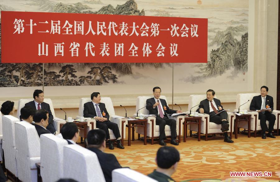 Zhang Gaoli (3rd R), a member of the Standing Committee of the Political Bureau of the Communist Party of China (CPC) Central Committee, joins a discussion with deputies to the 12th National People's Congress (NPC) from north China's Shanxi Province, who attend the first session of the 12th NPC, in Beijing, capital of China, March 8, 2013. (Xinhua/Xie Huanchi)