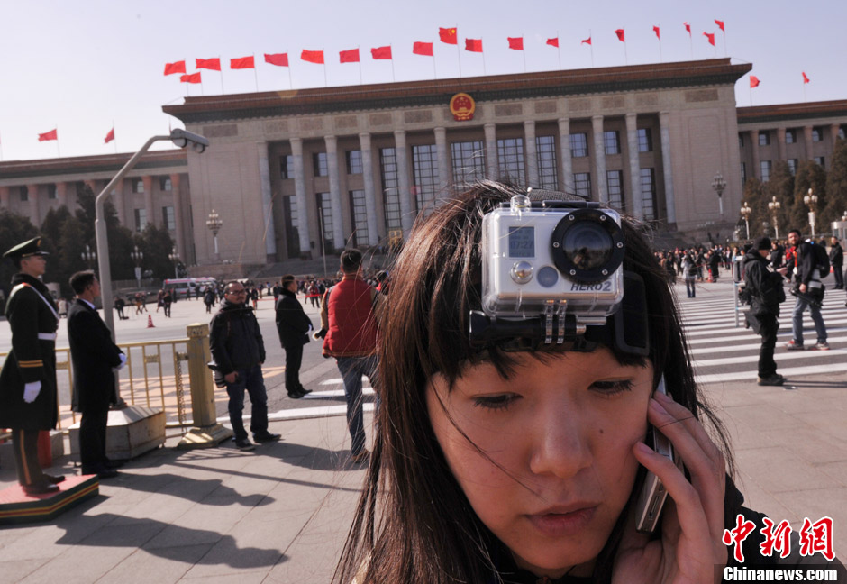 A female journalist wears a head-mounted camera. (Photo/CNS)