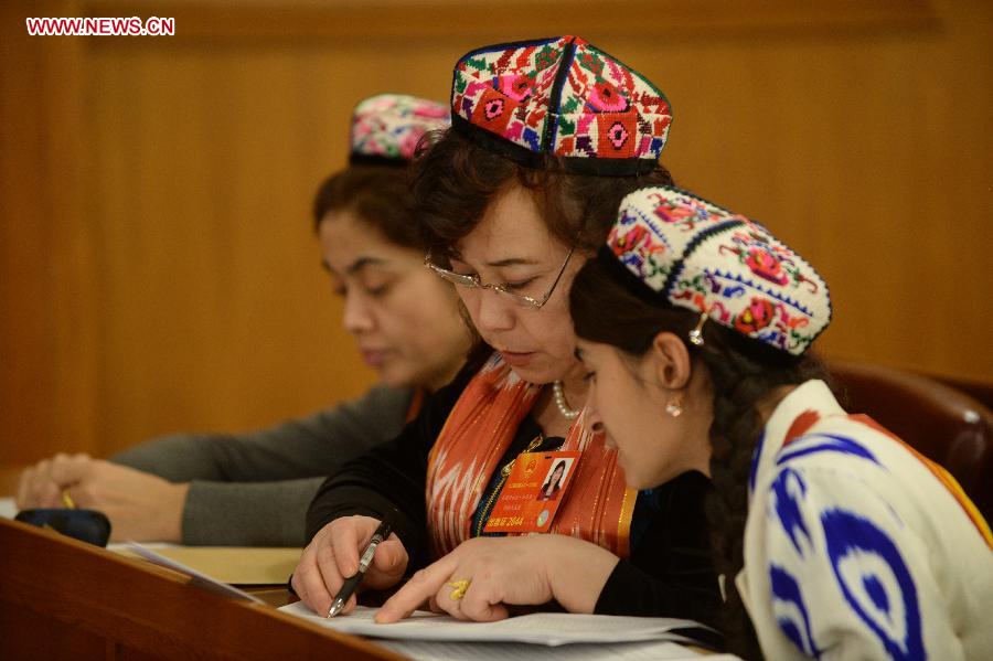 Female deputies to the 12th National People's Congress (NPC) attend the second plenary meeting of the first session of the 12th NPC in Beijing, capital of China, March 8, 2013. Women's presence in China's politics has been increasing in recent decades. The number of female deputies to the 12th National People's Congress and members of the 12th National Committee of the Chinese People's Political Consultative Conference (CPPCC) rise to 699 and 399, reaching 23.4% and 18.4% of the total respectively. (Xinhua/Wang Jianhua) 