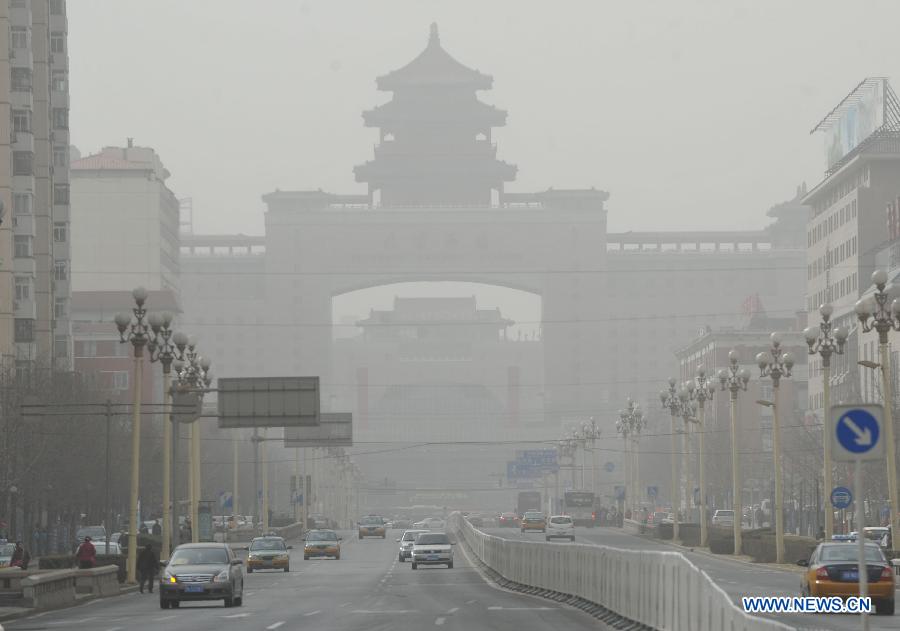 Photo taken on March 9, 2013 shows the dust-blanketed Beijing West Railway Station in Beijing, capital of China. A cold front brings strong wind as well as sand and dust to Beijing on March 9. (Xinhua/Gong Lei)