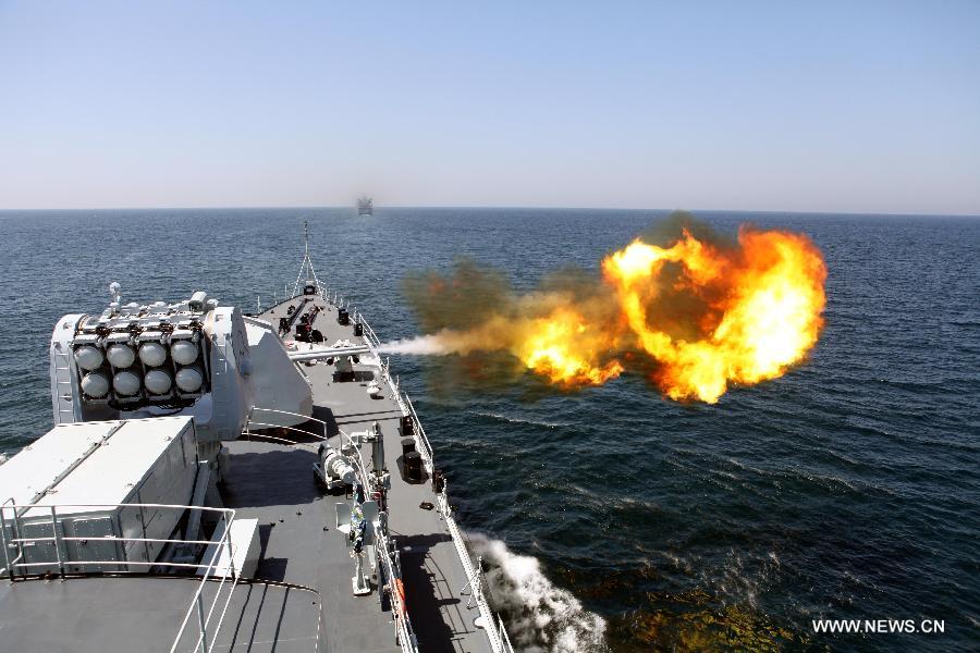 Chinese Navy's missile destroyer "Harbin" fires during the AMAN-13 exercise in the Arabian Sea, March 8, 2013. Naval ships from 14 countries, including China, the United States, Britain and Pakistan, joined a five-day naval drill in the Arabian Sea from March 4, involving 24 ships, 25 helicopters, and special forces. (Xinhua/Rao Rao)