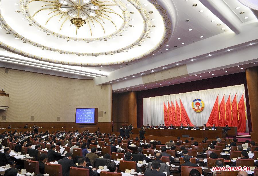 The presidium of the first session of the 12th National Committee of the Chinese People's Political Consultative Conference (CPPCC) hold their second meeting in Beijing, capital of China, March 9, 2013. (Xinhua/Rao Aimin)