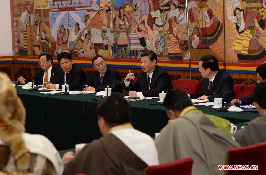 Xi Jinping (4th L), general secretary of the Central Committee of the Communist Party of China (CPC), joins a discussion with deputies from southwest China's Tibet Autonomous Region, who attend the first session of the 12th National People's Congress (NPC), in Beijing, capital of China, March 9, 2013. (Xinhua/Ma Zhancheng)