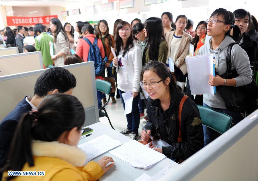 College students are seen during a job fair specially held for females in Nanjing, capital of east China's Jiangsu Province, March 9, 2013. A job fair for female college students were held here on Saturday, providing more than 3,000 positions from some 100 employers. (Xinhua/Sun Can) 