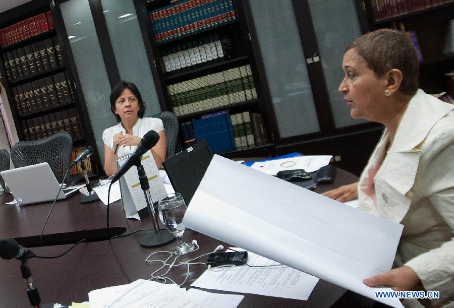 The President of the National Electoral Council of Venezuela (CNE, by its' acronym in Spanish), Tibisay Lucena (R), attends to an extraordinary meeting of the Council, in the city of Caracas, capital of Venezuela, on March 9, 2013. The CNE will set the date to call the presidential election to succeed Venezuelan late leader Hugo Chavez. (Xinhua/Juan Carlos Hernandez) 