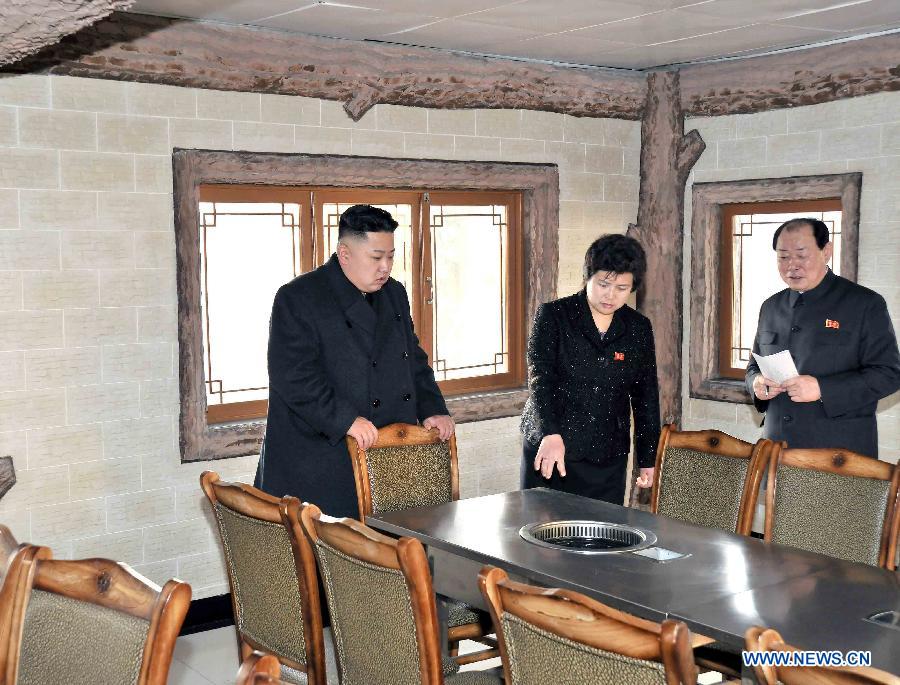 Photo released by Korean Central News Agency (KCNA) on March 9, 2013 shows top leader of the Democratic People's Republic of Korea (DPRK) Kim Jong Un (L) inspecting the sports village in Chongchun Street, March 8, 2013. The village was built on the occasion of the 40th anniversary of the founding of the DPRK. It is a comprehensive sports and cultural centre with gymnasiums, sports persons' restaurant, hotels and welfare service facilities. (Xinhua/KCNA) 