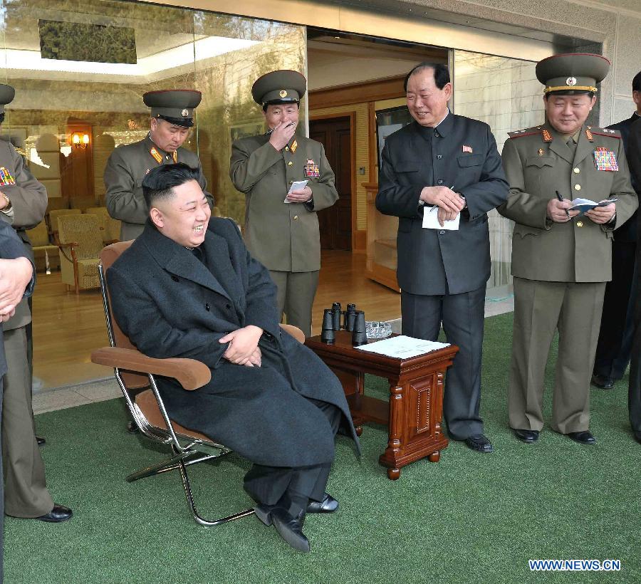 Photo released by Korean Central News Agency (KCNA) on March 9, 2013 shows top leader of the Democratic People's Republic of Korea (DPRK) Kim Jong Un (L) watching a match between the archery players of the April 25 Defense Sports Team and Amnokgang Defense Sports Team. (Xinhua/KCNA)