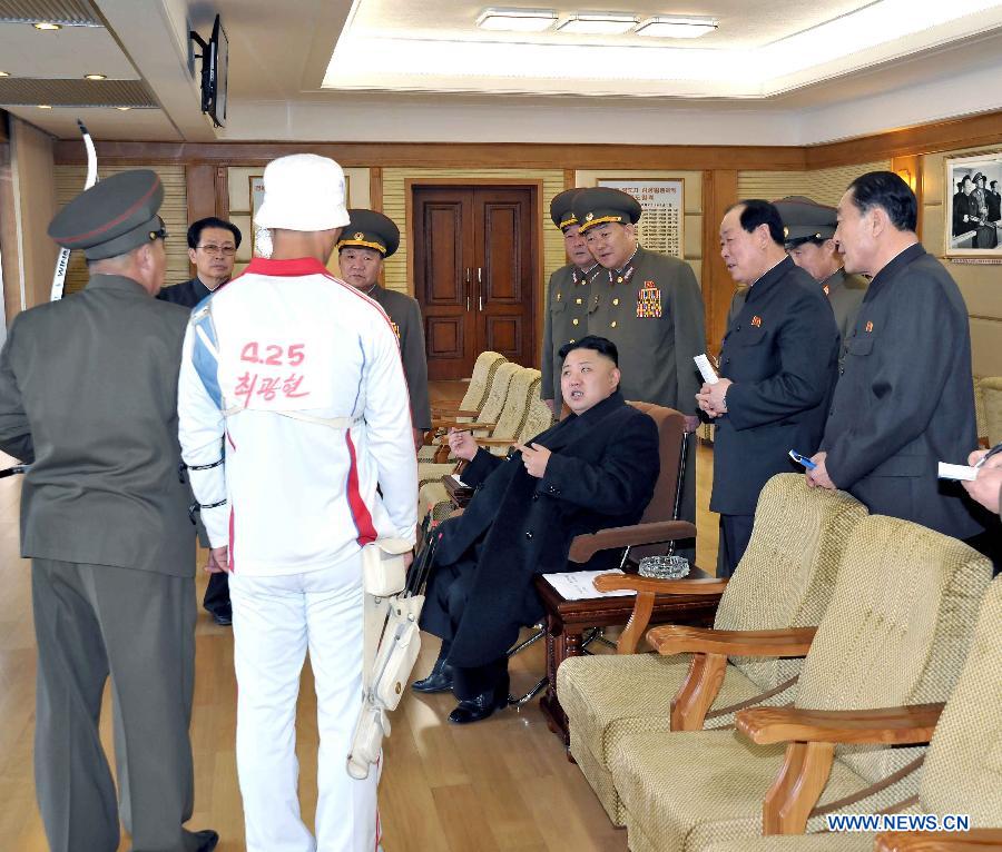 Photo released by Korean Central News Agency (KCNA) on March 9, 2013 shows top leader of the Democratic People's Republic of Korea (DPRK) Kim Jong Un (C) before watching a match between the archery players of the April 25 Defense Sports Team and Amnokgang Defense Sports Team. (Xinhua/KCNA)