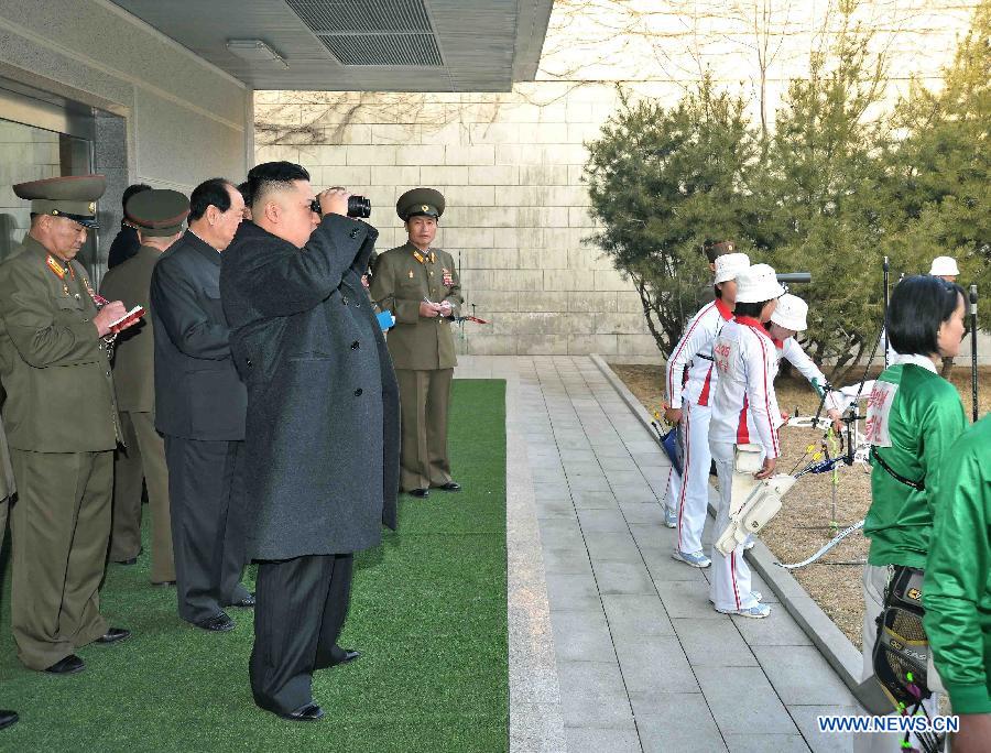Photo released by Korean Central News Agency (KCNA) on March 9, 2013 shows top leader of the Democratic People's Republic of Korea (DPRK) Kim Jong Un watching a match between the archery players of the April 25 Defense Sports Team and Amnokgang Defense Sports Team. (Xinhua/KCNA) 