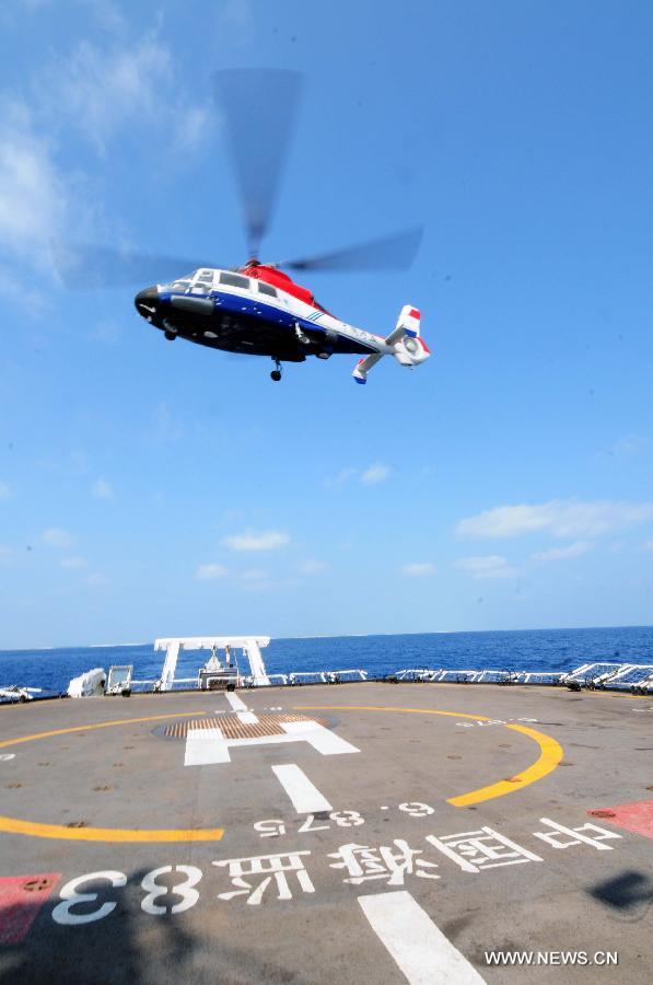 The Haijian B-7103 helicopter takes off from a Chinese marine surveillance ship in the South China Sea, March 10, 2013. A China Marine Surveillance (CMS) detachment on Sunday started a joint ship-helicopter patrol of the Xisha Islands in the South China Sea. Three CMS ships -- the Haijian 83, Haijian 262 and Haijian 263 -- departed from the port of Sansha City at 9 a.m. and will be joined by the Haijian B-7103 helicopter as they patrol the waters for nine days, said Zhang Weijian, the on-site director of the mission. (Xinhua/Wei Hua) 