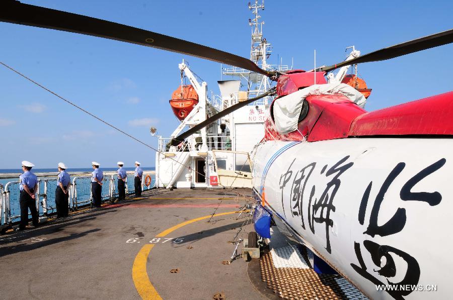 A helicopter on a Chinese marine surveillance ship prepares to take off as a China Marine Surveillance detachment carries out regular patrolling and observation missions including the management of maritime space and protection of marine ecology and islands in waters of Sansha, China's southernmost city, March 10, 2013. (Xinhua/Wei Ye)