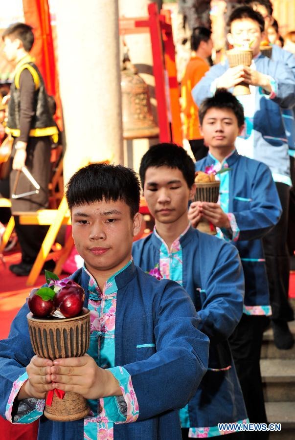 Students from Taipei Kai-Ping Culinary School participate in a spring sacrificing ceremony at the Confucius Temple in Taipei, southeast China's Taiwan, March 10, 2013. The annual ancient-style ceremony was held here on Sunday to encourage students to set clear goals and study hard in the beginning of a year. (Xinhua/Wu Ching-teng) 