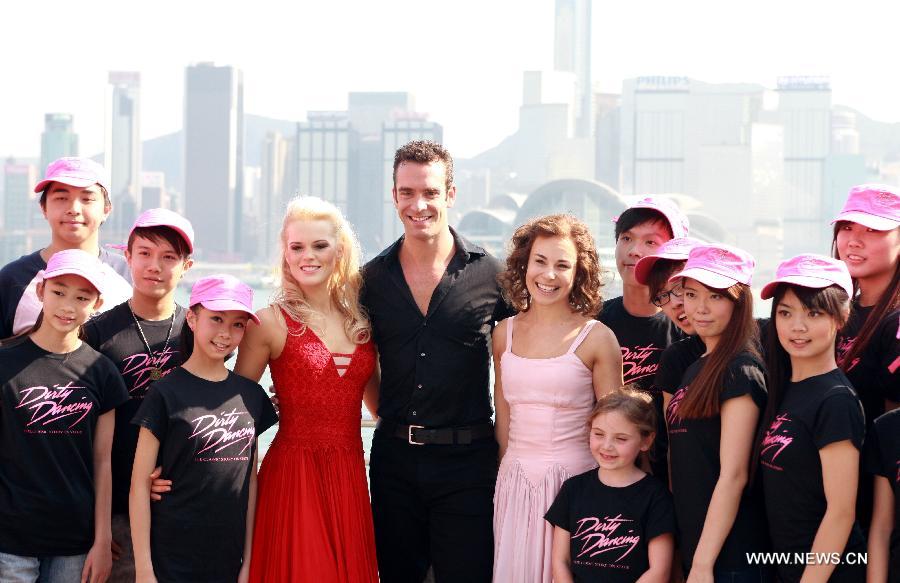 The actors of music drama "Dirty Dancing" attend a promotion campaign at Tsim Sha Tsui in Hong Kong, south China, March 10, 2013. The music drama would be shown in Hong Kong since April 19. (Xinhua/Jin Yi)