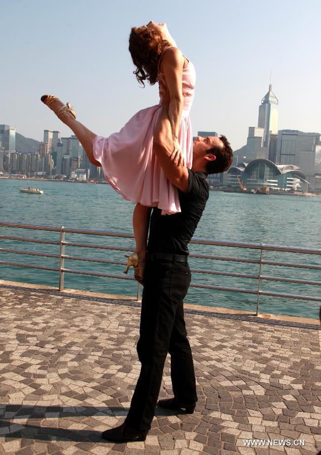 The actors of music drama "Dirty Dancing" perform during a promotion campaign at Tsim Sha Tsui in Hong Kong, south China, March 10, 2013. The music drama would be shown in Hong Kong since April 19. (Xinhua/Jin Yi)