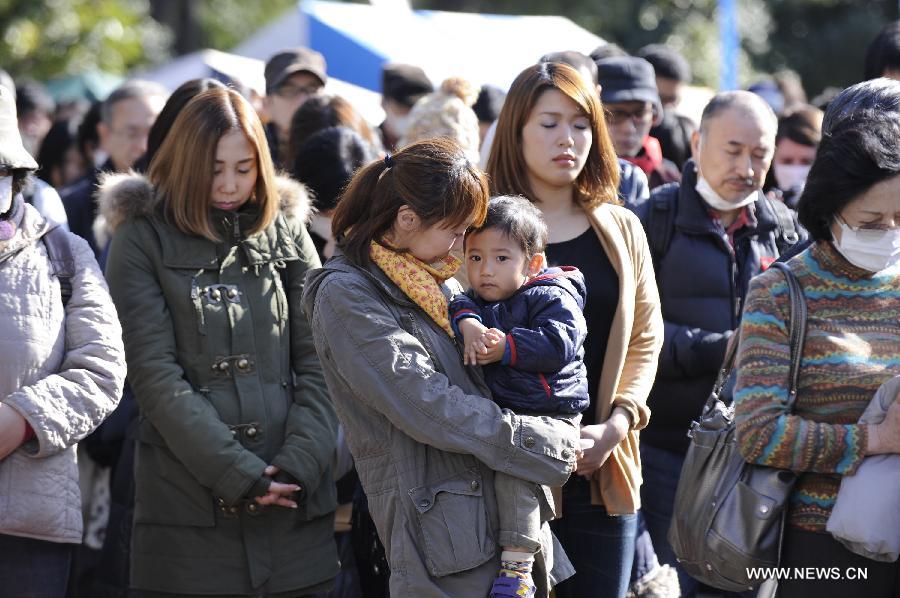 People attend a mourning ceremony in Tokyo, capital of Japan, on March 11, 2013. A mourning ceremony was held here Monday to mark the two year anniversary of the March 11 earthquke and ensuing tsunami that left more than 19,000 people dead or missing and triggered a nuclear accident the world had never seen since 1986. (Xinhua/Kenichiro Seki) 