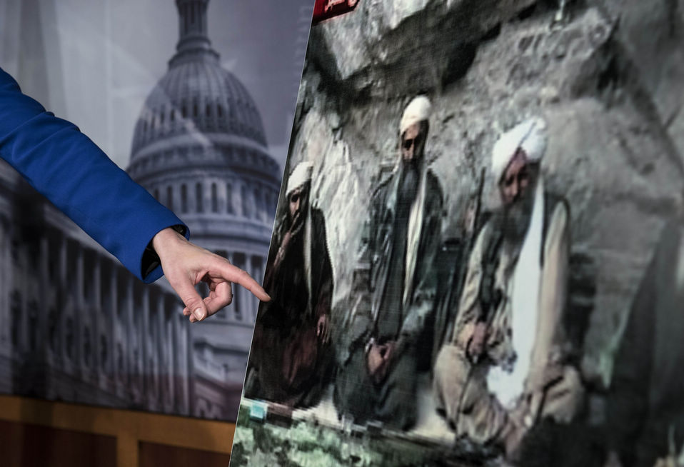 Senator Kelly Ayotte points to a photo of Sulaiman Abu Ghaith, left, during a press conference on Capitol Hill in Washington on March 7, 2013. (Xinhua News Agency/AFP)