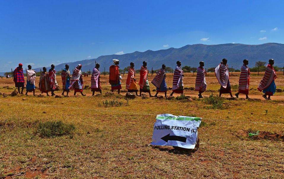 Maasai tribes-people leave after voting in Ilngarooj, Kajiado South County, Maasailand, on March 4, 2013 during Kenya's elections. Kenyan voters returned to the polls today for the first time since bloody post-poll violence broke out five years ago that resulted in over 1,100 people killed and some 600,000 displaced. According to media reports, at least 15 were killed today in attacks as most voters experienced long lines at the polls. 14.3 million voters were expected to turn out for Election Day.(Xinhua News Agency/AFP)