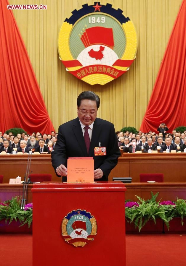 Yu Zhengsheng casts his ballot at the fourth plenary meeting of the first session of the 12th National Committee of the Chinese People's Political Consultative Conference (CPPCC) at the Great Hall of the People in Beijing, capital of China, March 11, 2013. Chairman, vice-chairpersons, secretary-general and Standing Committee members of the 12th CPPCC National Committee will be elected here on Monday afternoon. (Xinhua/Liu Weibing)