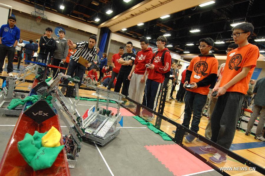 Students from over 96 high-schools across North America compete in 2013 VEX Robotics Competition at British Columbia Institute of Technology (BCIT) in Burnaby, BC, Canada on March 9, 2013. Using VEX Robotics Design System, competing teams, with guidance from their teachers and mentors, build the most innovative robots possible, working together to score the most points against opposing teams. This is the qualifying event for the upcoming 2013 VEX Robotics Competition World Championship being held in Anaheim, April 17-20, 2013. (Xinhua/Sergei Bachlakov) 