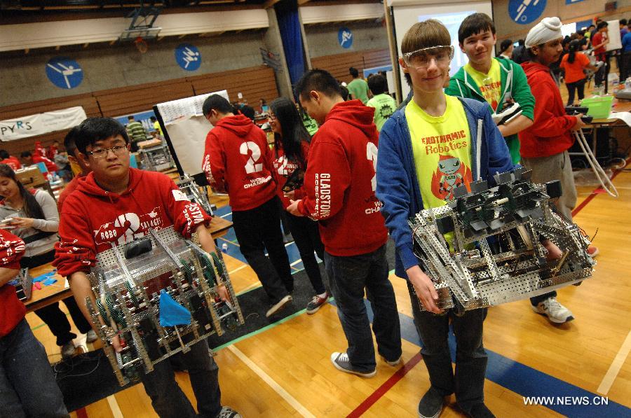 Students from over 96 high-schools across North America compete in 2013 VEX Robotics Competition at British Columbia Institute of Technology (BCIT) in Burnaby, BC, Canada on March 9, 2013. Using VEX Robotics Design System, competing teams, with guidance from their teachers and mentors, build the most innovative robots possible, working together to score the most points against opposing teams. This is the qualifying event for the upcoming 2013 VEX Robotics Competition World Championship being held in Anaheim, April 17-20, 2013. (Xinhua/Sergei Bachlakov)  