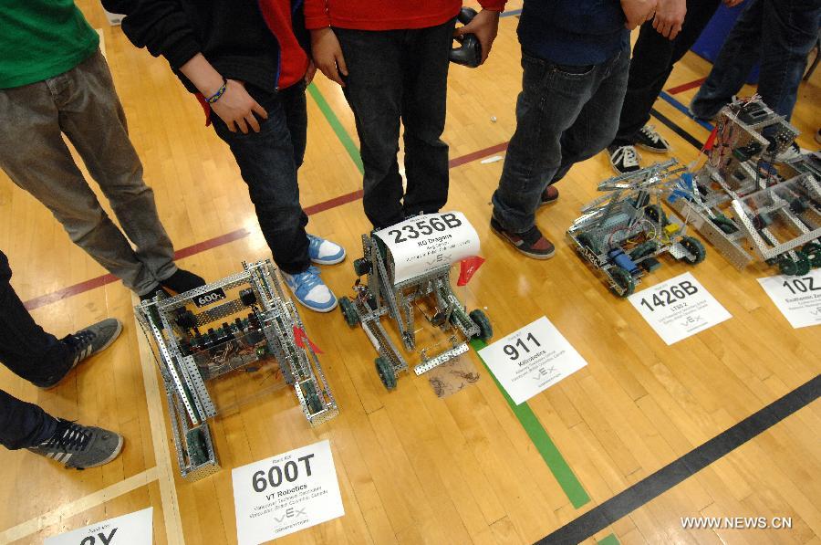 Students from over 96 high-schools across North America compete in 2013 VEX Robotics Competition at British Columbia Institute of Technology (BCIT) in Burnaby, BC, Canada on March 9, 2013. Using VEX Robotics Design System, competing teams, with guidance from their teachers and mentors, build the most innovative robots possible, working together to score the most points against opposing teams. This is the qualifying event for the upcoming 2013 VEX Robotics Competition World Championship being held in Anaheim, April 17-20, 2013. (Xinhua/Sergei Bachlakov) 