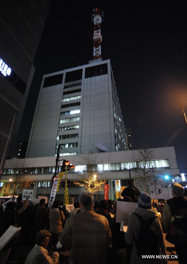 Protestors demonstrate outside the Tokyo Electric Power Company (TEPCO) in Tokyo, Japan, March 11, 2013. People demonstrated outside the TEPCO on the 2nd anniversary of 2011 earthquake, during which Fukushima nuclear plant of TEPCO had a nuclear accident. They asked for compensation to Fukushima residents and protested against the reopen of nuclear plants. (Xinhua/Kenichiro Seki)