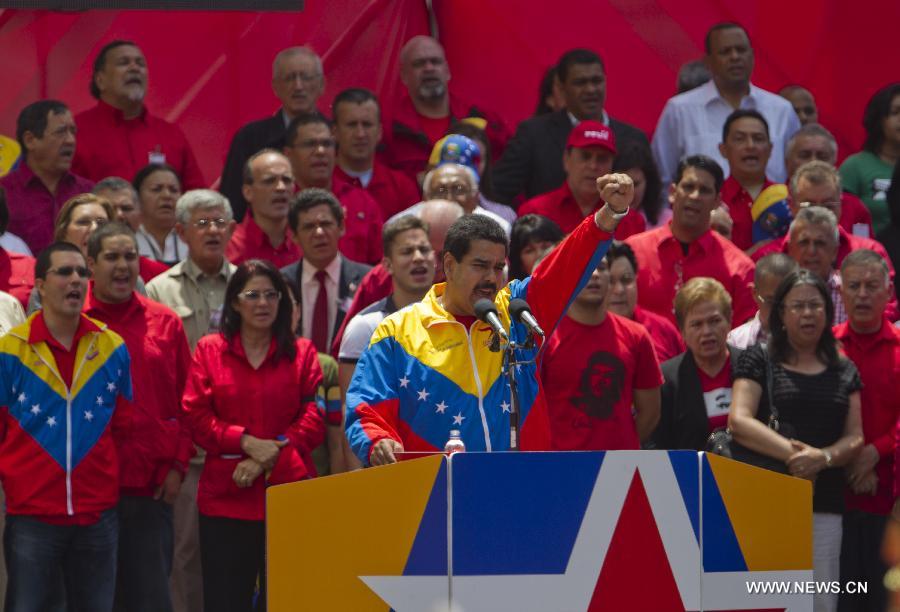 Venezuela's acting President Nicolas Maduro (front) participates in a ceremony of his official registration as the ruling United Socialist Party of Venezuela (PSUV)'s candidate for presidential elections of April 14, at Venezuela's National Electoral Council (CNE) in Caracas, capital of Venezuela, on March 11, 2013. (Xinhua/David de la Paz) 