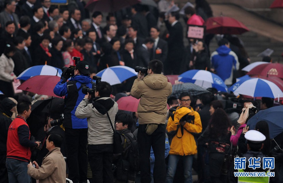 An expected spring rain adds glamour to the scenery of the Great Hall of the People in Beijing. The closing meeting of the first session of the 12th National Committee of the Chinese People's Political Consultative Conference (CPPCC) was held at the Great Hall of the People in Beijing, capital of China, March 12, 2013. (Xinhua News Agency/Zhai Zihe)