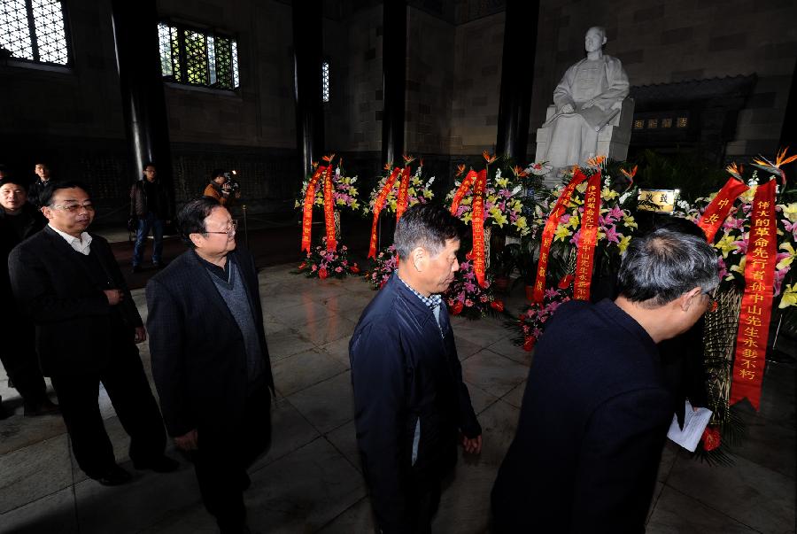 People pay a tribute in front of the statue of Dr. Sun Yat-sen at Dr. Sun Yat-sen's Mausoleum in Nanjing, capital of east China's Jiangsu Province, March 12, 2013. People gathered here on Tuesday to commemorate the 88th anniversary of the passing away of Dr. Sun Yat-sen, a revered revolutionary leader who played a pivotal role in overthrowing imperial rule in China. (Xinhua/Han Yuqing)