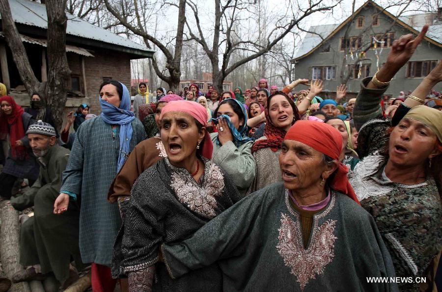 Kashmiris shout slogans as they mourn over the death of a truck driver Riyaz Ahmad Khanday during his funeral procession at Matipora village in Anantnag district, 70km south of Srinagar, the summer capital of Indian-controlled Kashmir, March 12, 2013. A 23-year-old youth was killed after Indian army troopers opened gunfire on protesters in Baramulla town, around 55 km northwest of Srinagar city. The killing triggered massive anti-India protests and clashes in which Khanday was badly hurt and later died in a Srinagar hospital on Monday evening, police said. (Xinhua/Javed Dar)