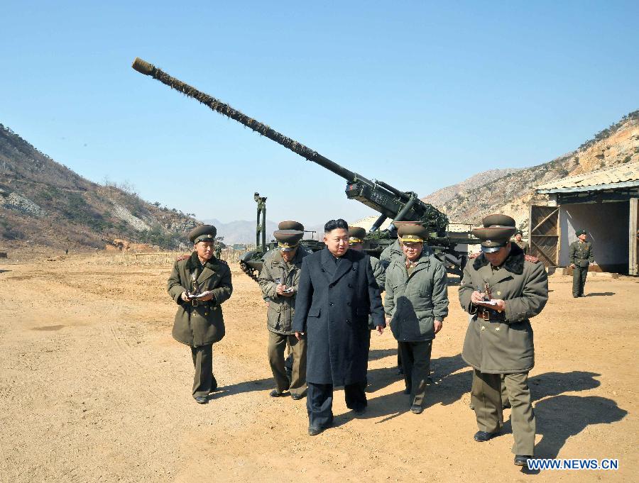 Photo released by KCNA news agency on March 12, 2013 shows Kim Jong Un (C), top leader of the Democratic People's Republic of Korea (DPRK), inspecting a long-range artillery sub-unit of Korean People's Army Unit 641, March 11, 2013. (Xinhua/KCNA)