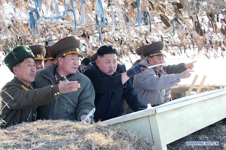 Photo released by KCNA news agency on March 12, 2013 shows Kim Jong Un, top leader of the Democratic People's Republic of Korea (DPRK), visiting the Wolnae-do Defence Detachment in the western front line, March 11, 2013. (Xinhua/KCNA)