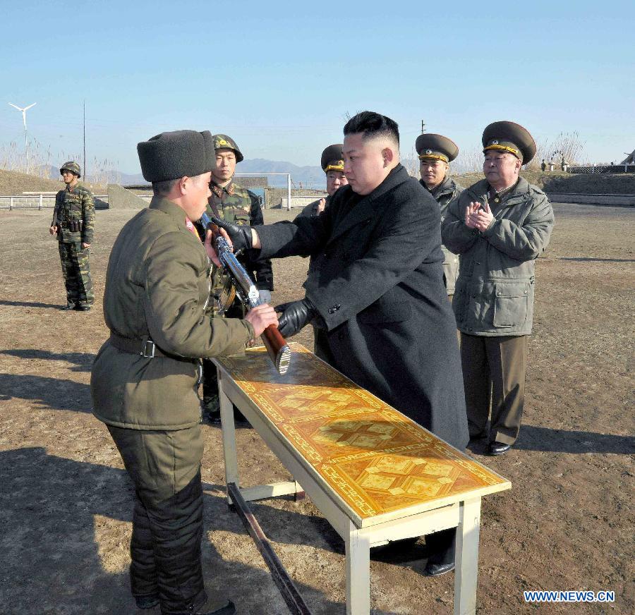 Photo released by KCNA news agency on March 12, 2013 shows Kim Jong Un, top leader of the Democratic People's Republic of Korea (DPRK), visiting the Wolnae-do Defence Detachment in the western front line, March 11, 2013. (Xinhua/KCNA) 