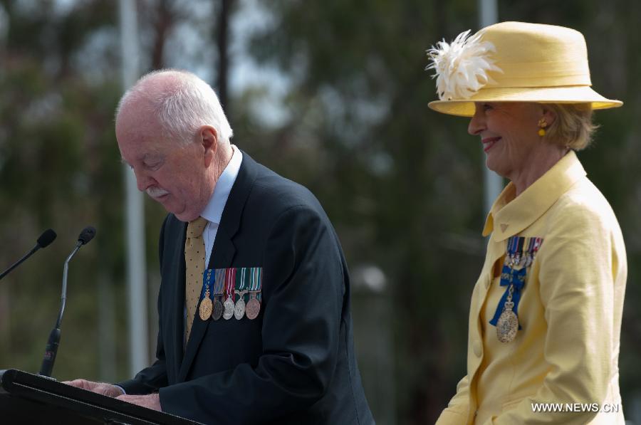 Michael Bryce (L), husband of Australia's Governor General Quentin Bryce, announces the name of "Canberra, as it remains" at the Centenary of Canberra Foundation Stone Ceremony in Canberra, Australia, March 12, 2013. Canberra marked its 100th birthday on Tuesday. (Xinhua/Justin Qian)  