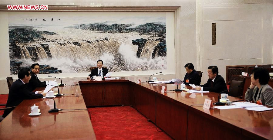 Zhang Dejiang (4th R), executive chairperson of the presidium of the first session of the 12th National People's Congress (NPC), presides over the third meeting of the presidium's executive chairpersons at the Great Hall of the People in Beijing, capital of China, March 12, 2013. (Xinhua/Lan Hongguang)