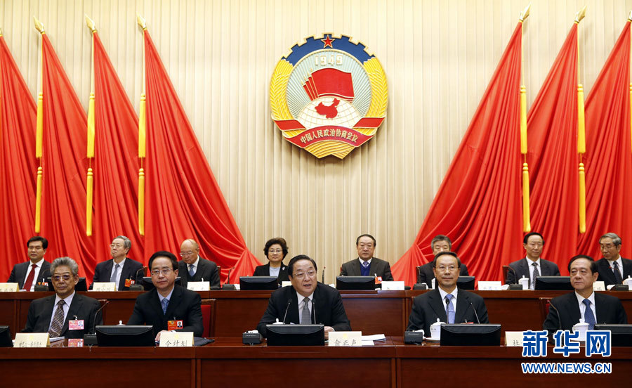 Yu Zhengsheng (C front), a member of the Standing Committee of the Political Bureau of the Communist Party of China (CPC) Central Committee, who is also chairman of the 12th National Committee of the Chinese People's Political Consultative Conference (CPPCC), presides over the opening meeting of the first conference of the Standing Committee of the 12th CPPCC National Committee in Beijing, capital of China, March 12, 2013. (Xinhua/Ju Peng)