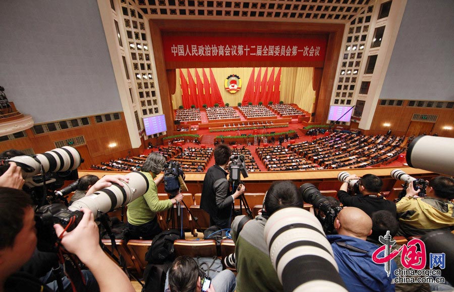 Photographers cover the fourth plenary meeting of the first session of the 12th National Committee of the Chinese People's Political Consultative Conference (CPPCC) held at the Great Hall of the People in Beijing, capital of China, March 11, 2013. Chairman, vice-chairpersons, secretary-general and Standing Committee members of the 12th CPPCC National Committee were elected here on Monday afternoon. (China.org.cn/ Yang Jia)