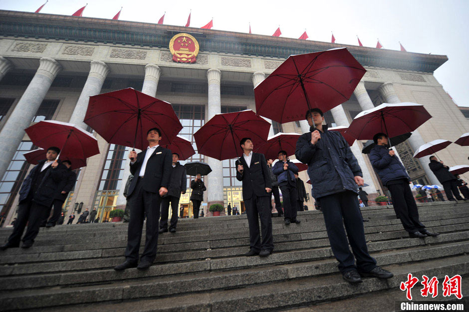Security staff in front of the Great Hall of the People. (CNS/Jin Shuo)