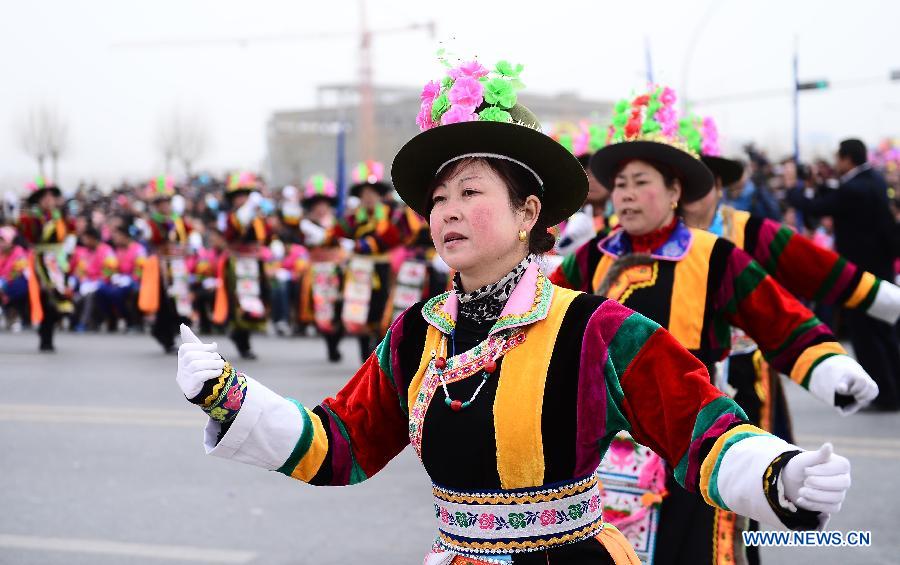Women from Tu ethnic group dressed in folk costumes dance during a celebration for "Er Yue Er" in Tu Autonomous County of Huzhu, northwest China's Qinghai Province, March 13, 2013, on the occasion of the second day of the second lunar month, known in Chinese as Er Yue Er, "a time for the dragon to raise its head", as a Chinese saying goes. Local residents gathered together and celebrated the festival with traditional performance. (Xinhua/Zhang Hongxiang)  